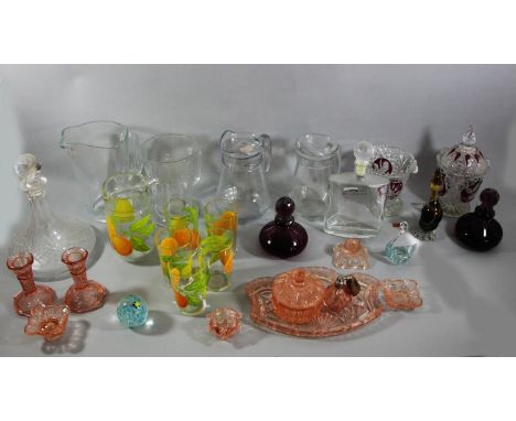 A collection of glassware to include a red byrdes lidded candy dish and vase, lead crystal drinks decanters, water jugs and a