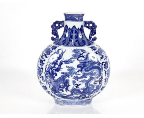 A hand painted Chinese porcelain two handled blue and white moon flask, decorated dragons, clouds and flowers, 30cm high&nbsp