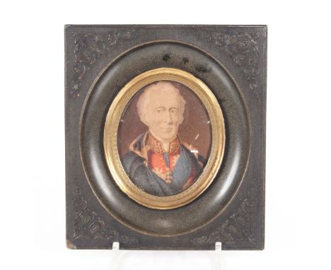A miniature portrait print of the Duke of Wellington in decorative floral frame