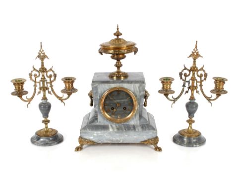 A 19th Century French grey marble clock garniture, the clock surmounted by brass urn, circular dial with 8 day movement strik