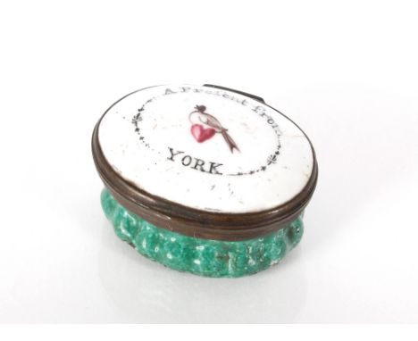 An 18th Century oval enamel patch box, the lid inscribed "A Present From York", 4cm