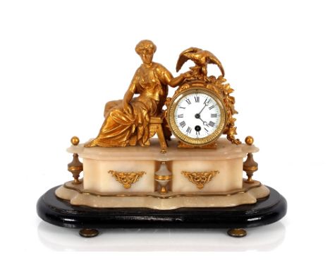 A 19th Century Ormolu and marble timepiece decorated with a figure of a reclining female feeding an eagle, circular Roman num