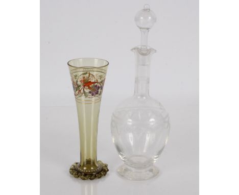 A 19th Century Bohemian green glass vase, having enamel floral and white dot decoration, raised on a wrythen spread foot, 22c