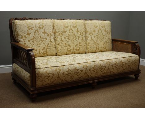 Early 20th century bergere lounge suite; three seats sofa (W170cm, D84cm), pair matching armchairs (W71cm), with scrolled aca