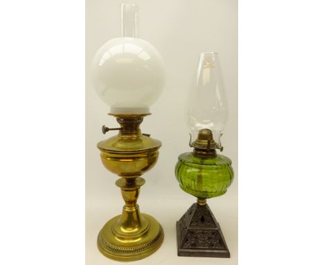 Late 19th century brass oil lamp with opaque glass shade, H61cm overall and another with pierced cast metal base & green glas