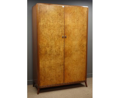 Mid 20th century walnut double wardrobe, two figured doors enclosing handing space and shelf, W123cm, H193cm, D52cm Condition