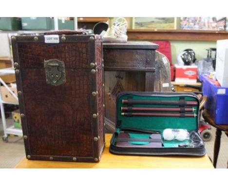 A MOCK CROC TWO BOTTLE CADDY together with a brand new travelling putting practice kit 