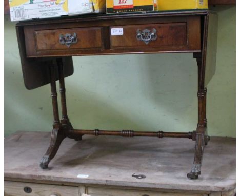 A REPRODUCTION MAHOGANY FINISHED COFFEE TABLE SIZED SOFA TABLE of typical form and construction 