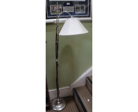 A CHROMED ADJUSTABLE FLOOR STANDARD READING LIGHT 