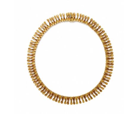 A FANCY LINK NECKLACE Composed of shaped alternating textured and polished fancy links, with indistinct marks to the conceale