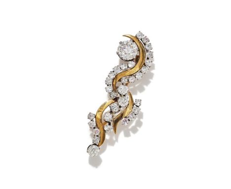 A DIAMOND AND 18CT GOLD BROOCH BIRMINGHAM 1988 Of undulating design, set with graduated old European and single cut diamonds,
