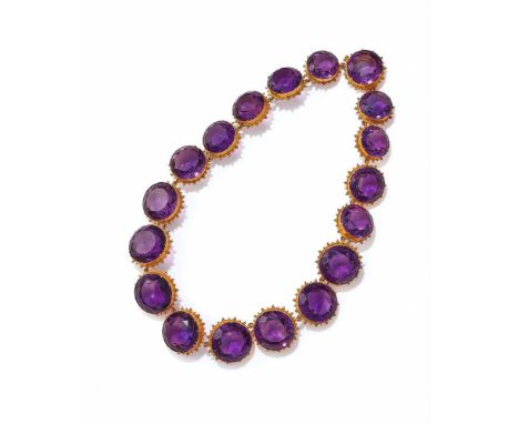 A 19TH CENTURY AMETHYST RIVIERE  CIRCA 1870 Composed of a graduated line of large circular cut amethysts in gold beadwork mou