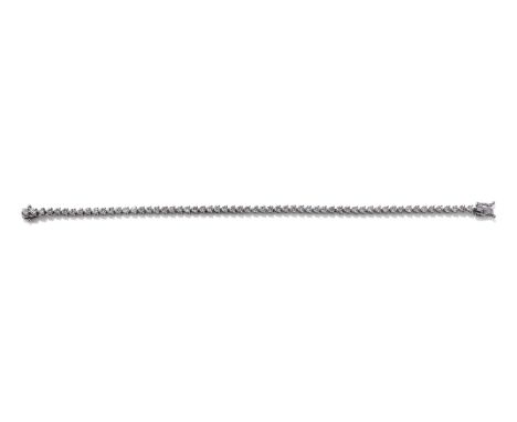 A DIAMOND LINE BRACELET Set with a continuous row of brilliant cut diamonds in three claw mounts, diamonds approximately 4.50