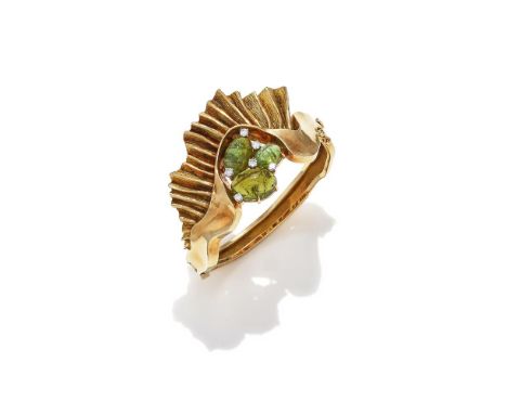 SVEN BOLTENSTERN, A PERIDOT AND DIAMOND BANGLE CIRCA 1970S The hinged, undulating front set with a cluster of oval cabochon p