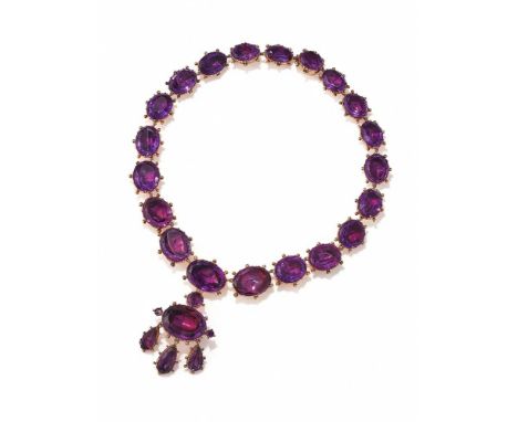 A GEORGIAN AMETHYST RIVIERE NECKLACE AND PENDANT/BROOCH CIRCA 1820 Composed of a graduated row of oval cut amethysts in close