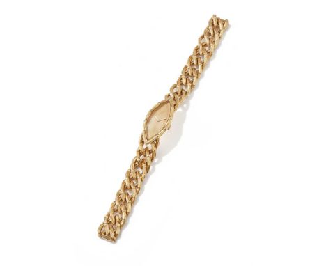 BOUCHERON, A LADY'S 18CT GOLD BRACELET WATCH  CIRCA 1965 The navette shaped textured gold dial with baton hour markers, withi