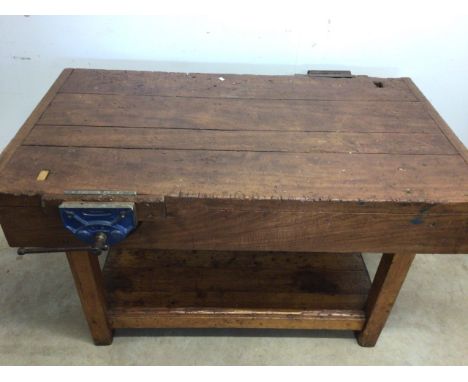 An antique Hardwood workbench with two vices and a lower shelf. W:140cm x D:85cm x H:78cm