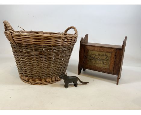 A small oak cupboard with copper panel inset into door of Ann Hathaways cottage, a metal nut cracker in the form of a dog tog