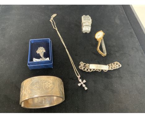 A silver identity bracelet together with a silver cuff bracelet, a silver brooch, chain and two watches 