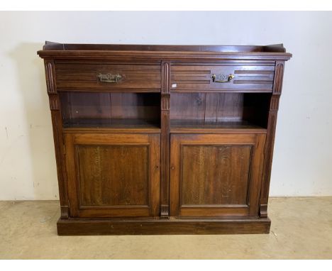 An early 20th c mahogany hall cupboard, two cupboard doors to base to interior shelves beneath open recess shelf with two dra