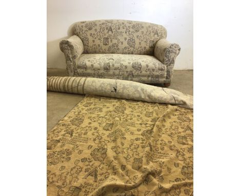 A modern drop end sofa on brass castors also with a roll of material. W:165cm x D:97cm x H:76cm