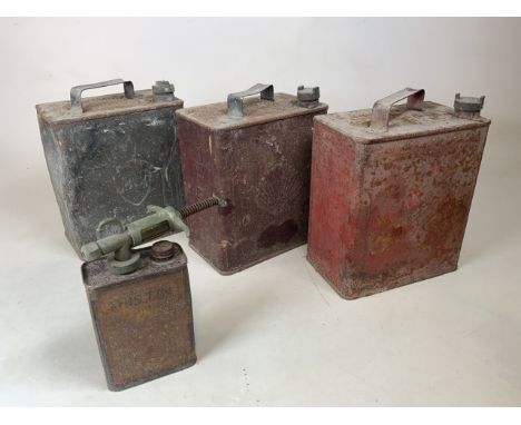 Four oil cans, two with shell logos and a BP motor oil container and an oil can W:24cm x D:15cm x H:28cm 