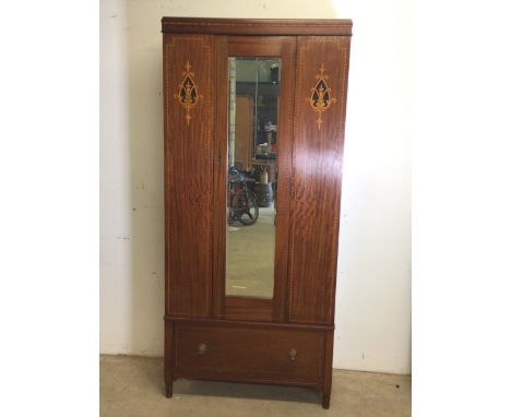 An inlaid single wardrobe with bevelled mirror door with deep drawer base. W:86cm x D:42cm x H:190cm