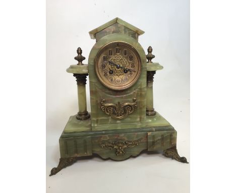 An large onyx mantle clock with brass ormolu mounts. W:36cm x D:16cm x H:37cm