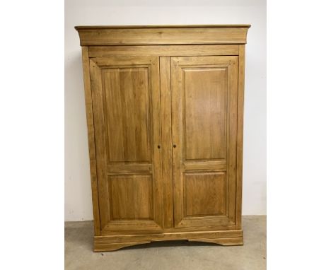 Modern oak double wardrobe wardrobe with interior shelves and hanging rails with later mirror to interior door. W:160cm x D:6