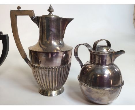 A silver plated tea set with other plated items. 