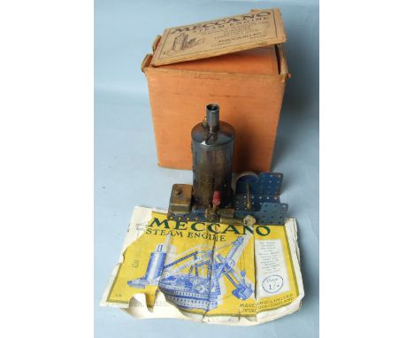 A Meccano vertical steam engine c1929 on base with forward/reverse lever, fuel tank and solid flywheel, in original box with 