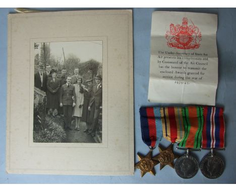 A group of four WWII medals awarded to F T B Mitchell RAF: 1939-1945 and Africa Stars, Defence Medal and 1939-1945 War Medal,