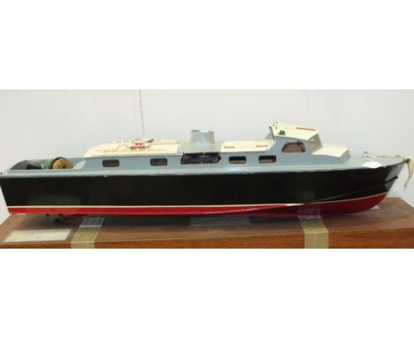 A scratch-built model of a launch finished black with blue-grey deck and red below the waterline, fitted with petrol engine, 