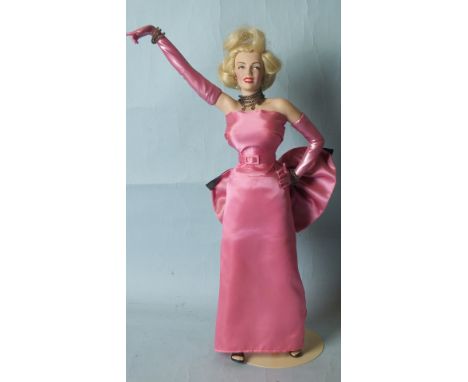 A Franklin Mint Heirloom portrait figure, "Marilyn - Diamonds are a Girl's Best Friend" with Perspex case.