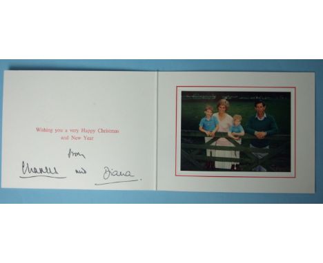 The Prince and Princess of Wales, 1988 Christmas card, signed by them both, with twin embossed gilt Royal ciphers to the cove