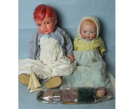 An Armand Marseille 351 bisque head baby doll with sleeping blue eyes, open mouth with lower teeth, on jointed character body
