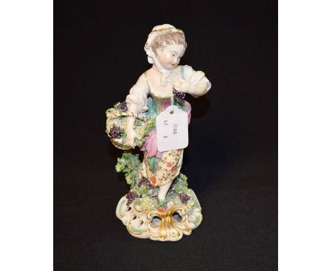 A Derby Patch Mark figure, Allegorical of Autumn, she stands, wearing a bonnet, bodice and floral skirt, holding a basket of 