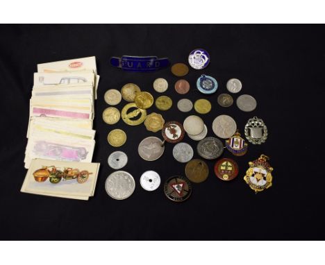 Coins and Badges - an 1896 South African 2 shillings; other world and British coins; an enamel railway guards cap badge; othe