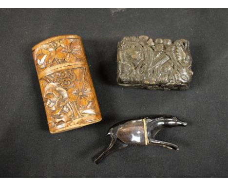 An unusual carved wood snuff box, carved with fish and grotesque heads; etc (3)