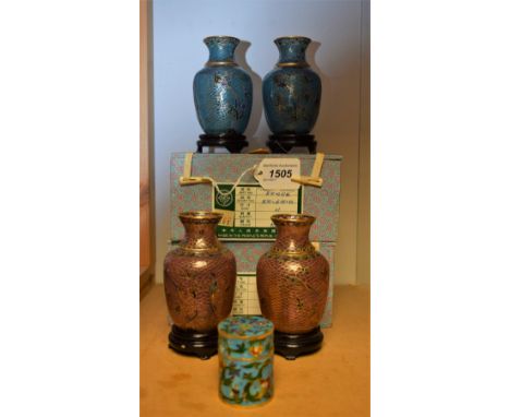 A pair of Chinese plique a Jour enamel waisted cylinder vases with carved wooden stands, decorated with birds of paradise, pi