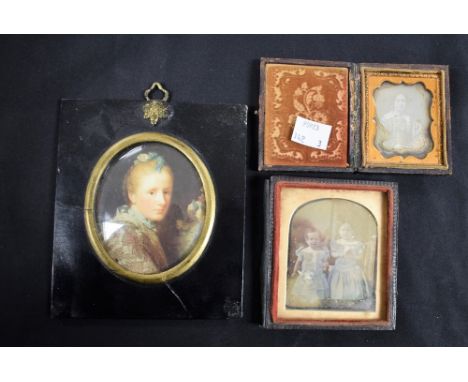 A 19th century Daguerreotype, lady seated, tooled leather frame;  another children;  a portrait miniature (3)