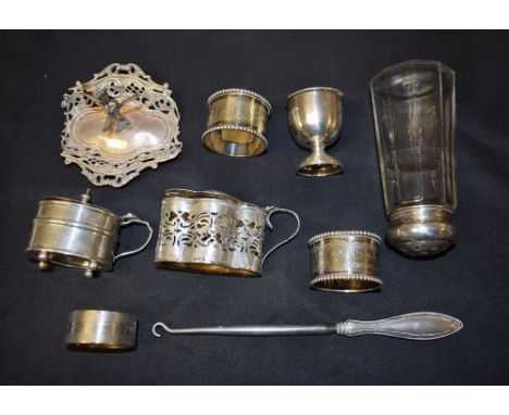 A silver mustard, Birmingham 1899; another, 1911; an egg cup, Sheffield 1919; napkin ring, button hook, etc