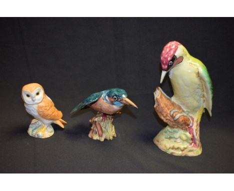 A Beswick model of a Woodpecker, impressed marks, 1218, 22cm high; a Beswick model of a Kingfisher, number 2371; a Beswick mi