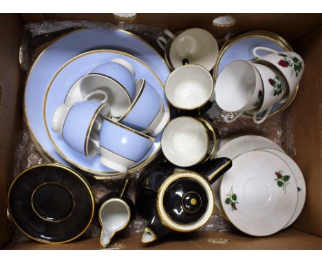 A Doulton powder blue part dinner service comprising four cups, saucers, side plates, bowls, dinner plates; a Seltmann six pl