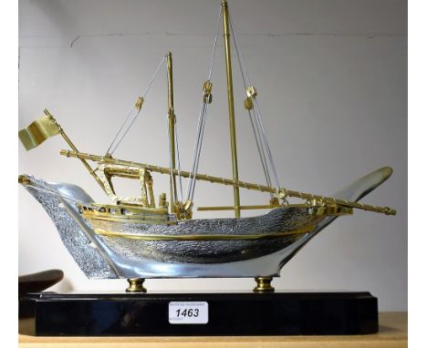 A cast silver and gold plated model boat