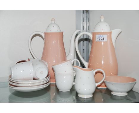 A Susie Cooper Coffee Set including six Coffee Cups and saucers, Cream Jug, Sugar Bowl, Coffee Pot and Hot Water Jug, in whit