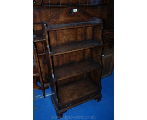 A good reproduction Oak open Waterfall Bookcase with trefoil pierced gallery top and shaped sides containing four graduated s