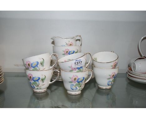 A Duchess china 'Chatsworth' Teaset, comprising six cups and tea plates, five saucers, sugar bowl, milk jug and bread and but