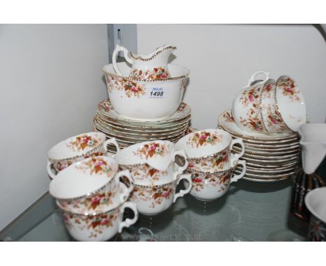 A Victorian Teaset comprising twelve tea plates and saucers, ten cups, cake plate, milk jug and slop bowl in floral and gilt 