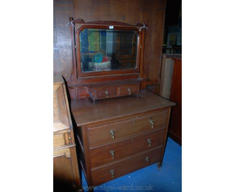 A circa 1900 Mahogany Dressing Chest with shaped bevel plate mirror in Mahogany frame in square finial topped supports and tw